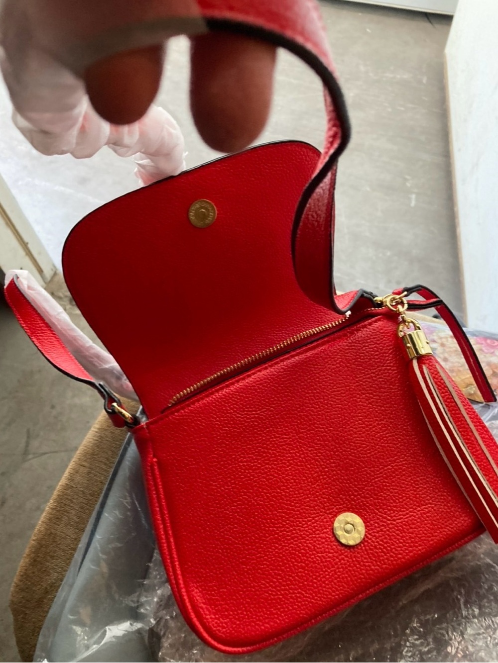 Compact Red Crossbody Bag with Tassel Accent